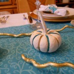 My son painted pumpkins and branches to decorate our table.